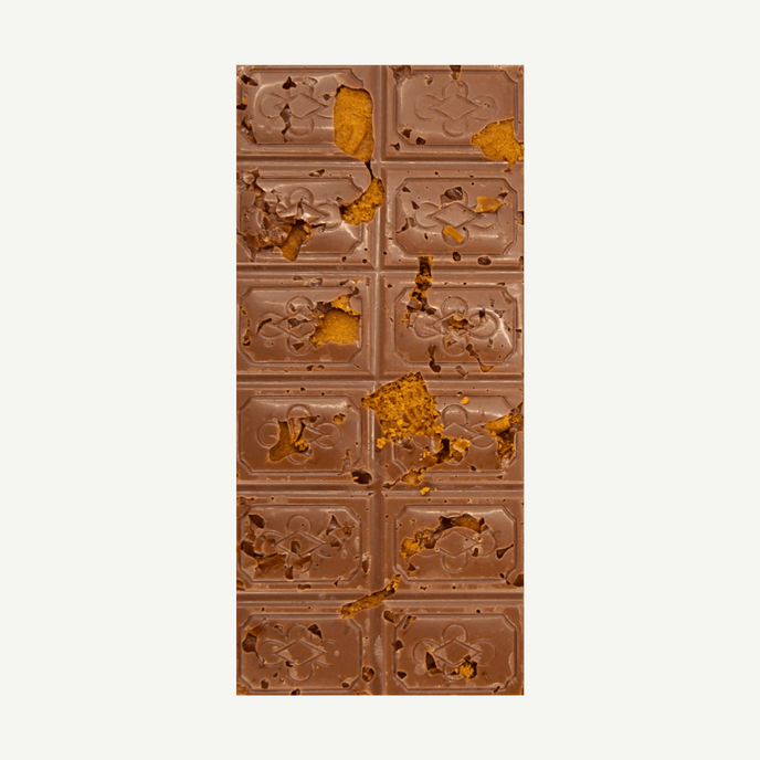 A decadent Belgian milk chocolate block loaded with Biscoff biscuit pieces and caramel crunch, sprinkled with sea salt.