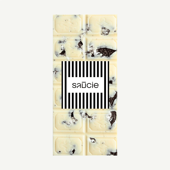 Cookies and cream white chocolate block served on a plate – indulgent handmade chocolate treat