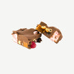 Chunky milk chocolate rocky road showing gluten free marshmallows, hazelnuts, caramel fudge and raspberry lollies