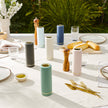 Navy blue Saucie bottle included in a gift hamper with condiments – practical and stylish