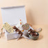 New Baby Hamper displayed at baby shower – premium Saucie gift with chocolates and cuddly toy