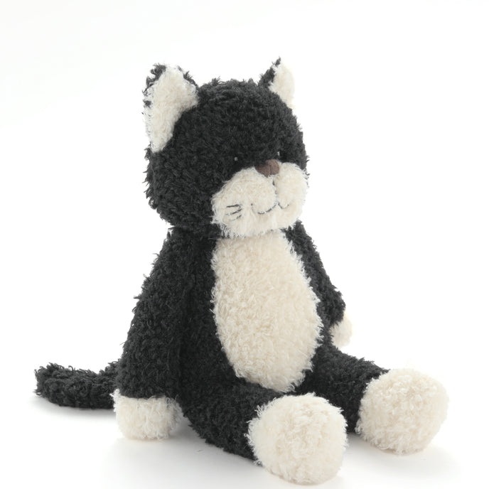 Black and white plush cat toy on a white background