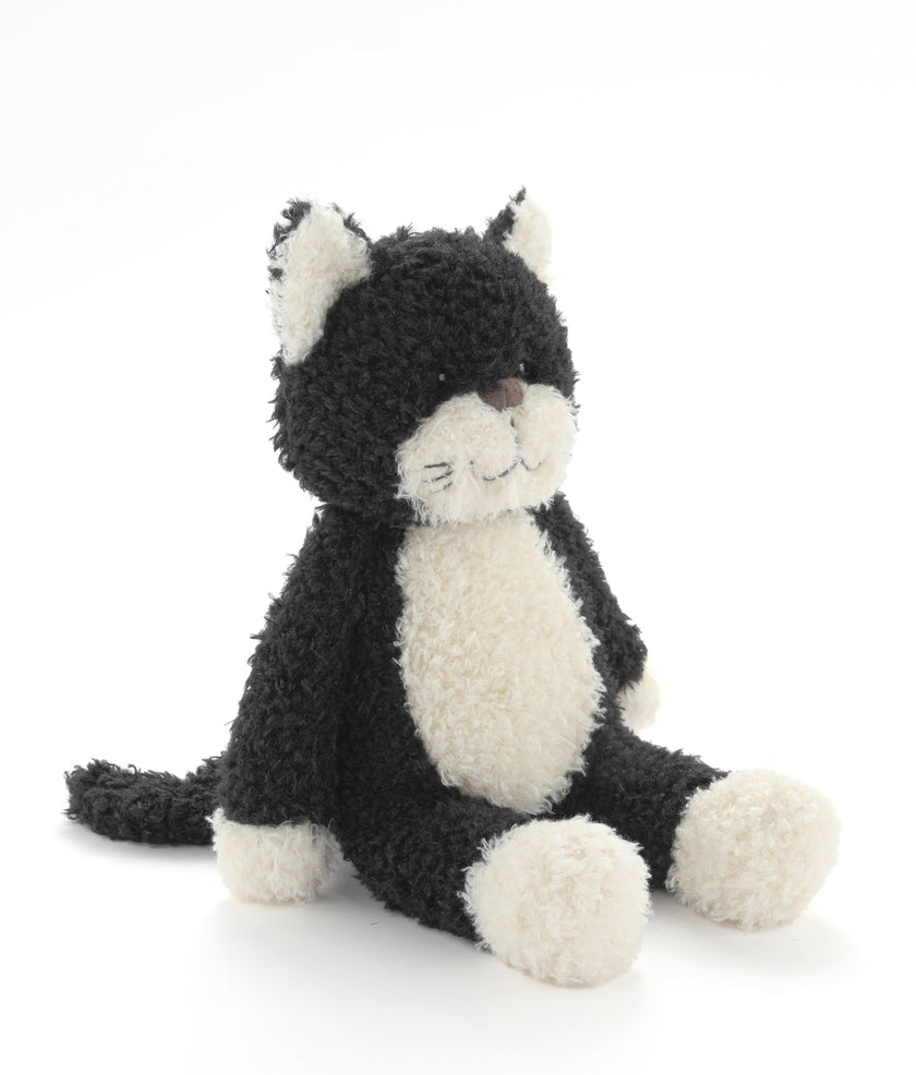 Black and white plush cat toy on a white background