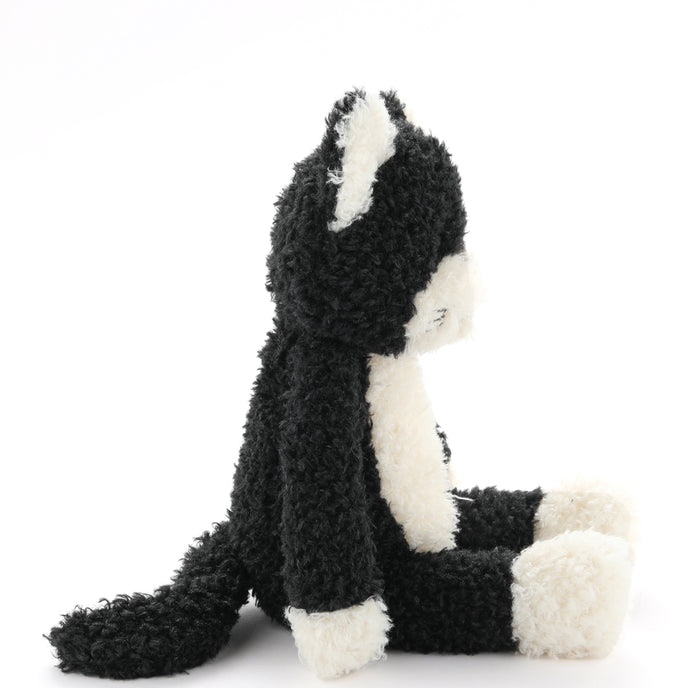 Plush toy skunk on a white background