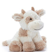 Plush cow toy on a white background