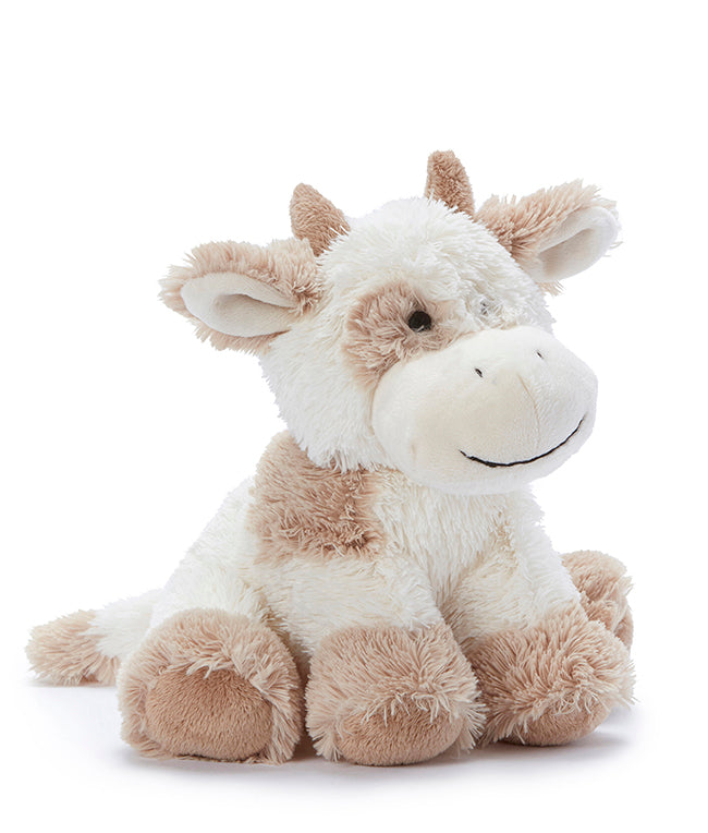 Plush cow toy on a white background