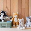 Four stuffed cat animals . Gifts, baby showers, kids