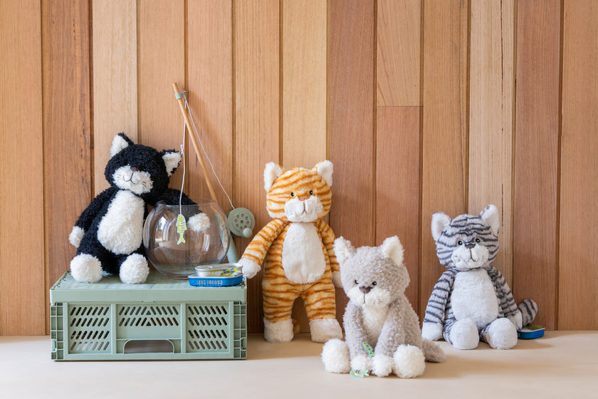 Four stuffed cat animals . Gifts, baby showers, kids