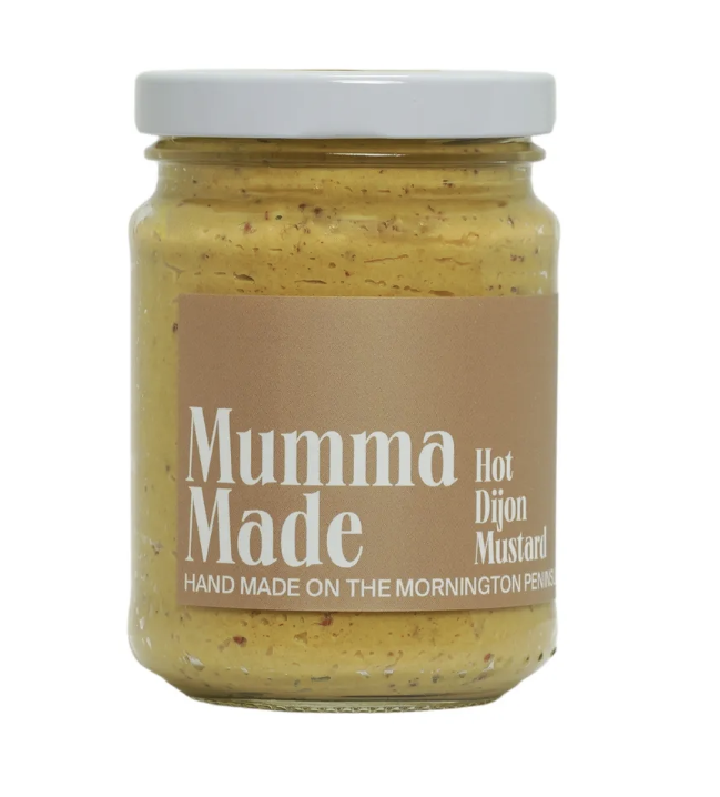 Jar of 'Mumma Made' hot Dijon mustard on a white background