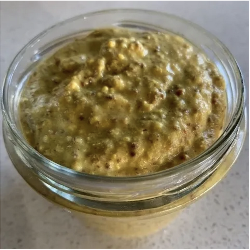 Jar of mustard food on a light background
