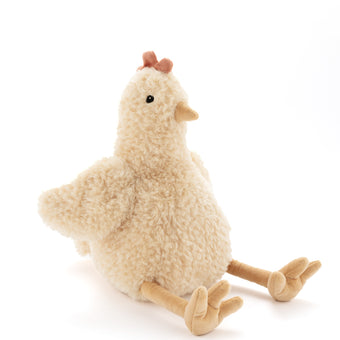 Plush toy chicken on a white background. Farm hand, animal lovers