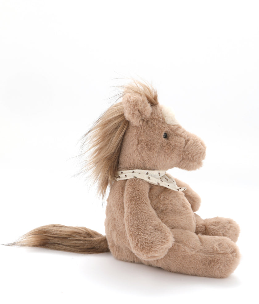 Plush horse toy with a white background