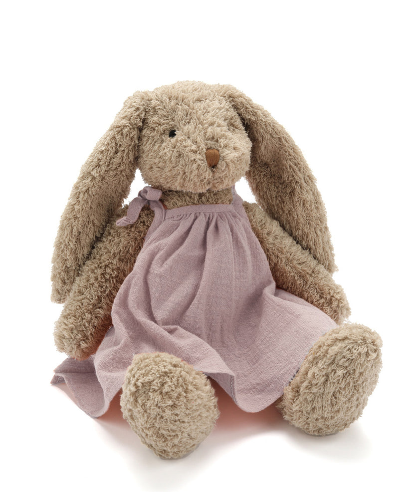 Plush bunny toy with a pink dress on a white background. Perfect for newborns or kids. Soft and cuddly