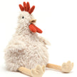 Plush toy rooster on a white background. Cuddly toy. Gift baby. Farm lovers