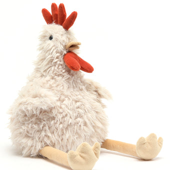 Plush toy rooster on a white background. Cuddly toy. Gift baby. Farm lovers