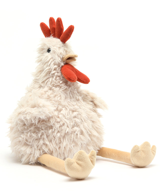 Plush toy rooster on a white background. Cuddly toy. Gift baby. Farm lovers