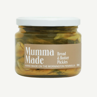 Jar of 'Mumma Made' bread and butter pickles on a white background