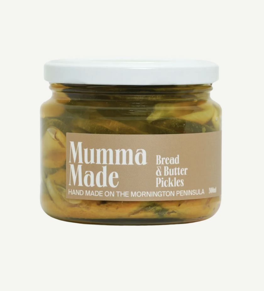 Jar of 'Mumma Made' bread and butter pickles on a white background