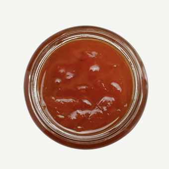 Jar of red jelly or jam on a white background