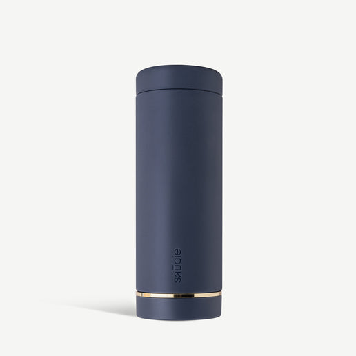 Navy blue reusable sauce bottle with a cap and a gold detail near the base.